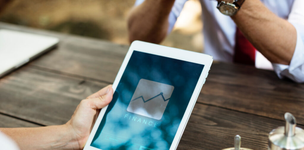 ipad-in-hand-edge-accounting holding ipad on table | edge accounting